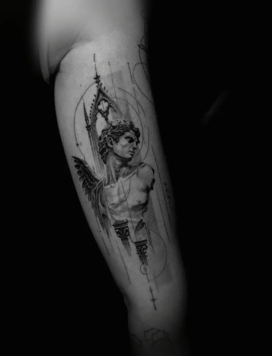 Black and grey realism of a classical male statue framed by a gothic arch and fine geometric lines, on a forearm.