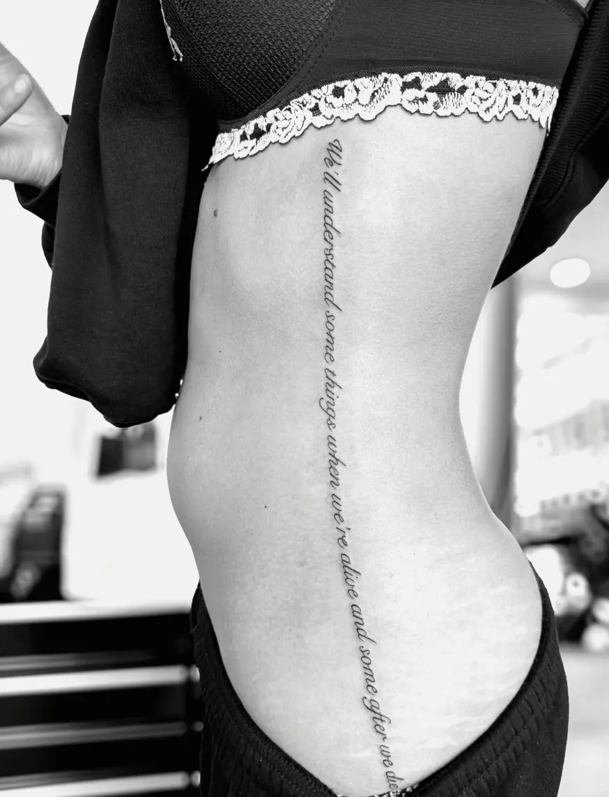A long line of cursive script running down the spine.